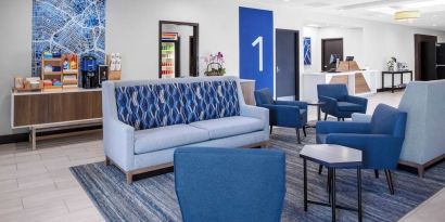 Lobby and coworking lounge at Holiday Inn Express & Suites Hermosa Beach.