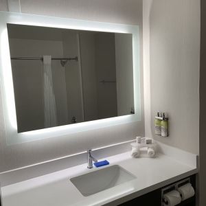 Guest bathroom with shower at Holiday Inn Express & Suites Hermosa Beach.