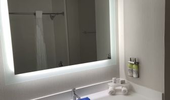 Guest bathroom with shower at Holiday Inn Express & Suites Hermosa Beach.