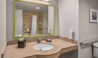 Guest bathroom with shower and tub at Hampton Inn & Suites Dallas/Allen.