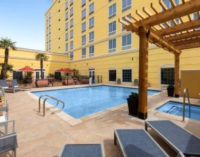 Refreshing outdoor pool and spa tub at La Quinta Inn & Suites San Antonio Medical Center NW.