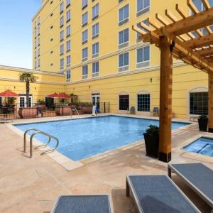 Refreshing outdoor pool and spa tub at La Quinta Inn & Suites San Antonio Medical Center NW.