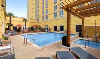 Refreshing outdoor pool and spa tub at La Quinta Inn & Suites San Antonio Medical Center NW.