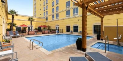 Refreshing outdoor pool and spa tub at La Quinta Inn & Suites San Antonio Medical Center NW.