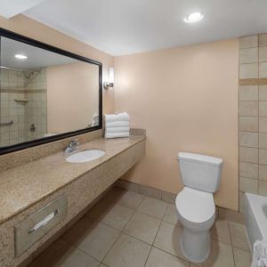 Guest bathroom with shower and tub at La Quinta Inn & Suites San Antonio Medical Center NW.