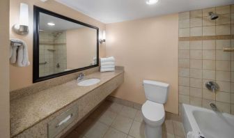 Guest bathroom with shower and tub at La Quinta Inn & Suites San Antonio Medical Center NW.