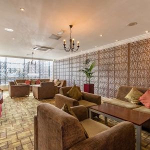 Bright and spacious lobby lounge with comfortable seating perfect for co-working at Thistle London Heathrow Terminal 5.