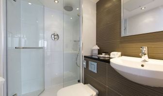 Guest bathroom with shower and free toiletries at Thistle Royal Trafalgar Square.