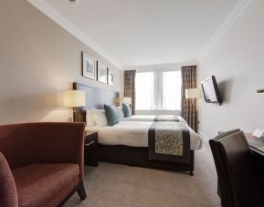 Day use twin room with work desk and sofa at Thistle Royal Trafalgar Square.