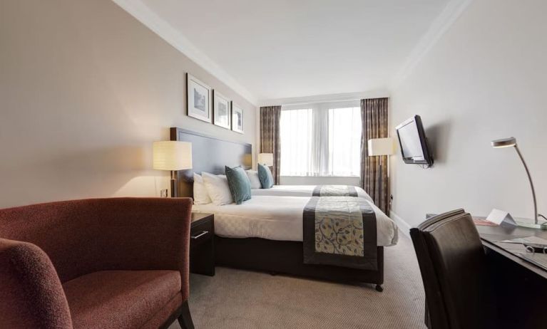 Day use twin room with work desk and sofa at Thistle Royal Trafalgar Square.