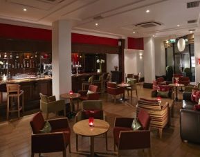 Hotel bar with lounge seating at Thistle Royal Trafalgar Square.