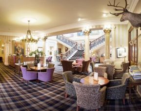 The Royal Highland Hotel’s lobby lounge has armchairs and coffee tables, perfect for co-working.