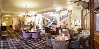 The Royal Highland Hotel’s lobby lounge has armchairs and coffee tables, perfect for co-working.