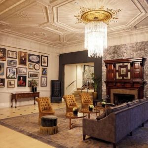 Lobby lounge with fireplace at The Royal Horseguards Hotel.