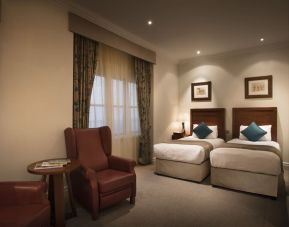 Day use twin room with lounge area at The Royal Horseguards Hotel.