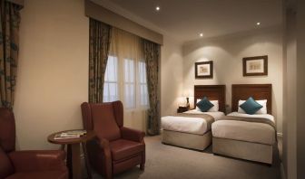 Day use twin room with lounge area at The Royal Horseguards Hotel.