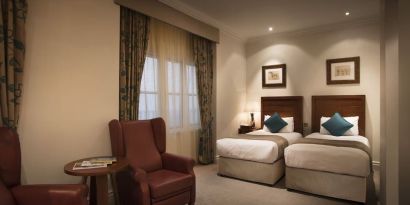 Day use twin room with lounge area at The Royal Horseguards Hotel.