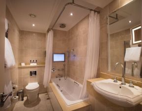 Guest bathroom with tub at The Royal Horseguards Hotel.