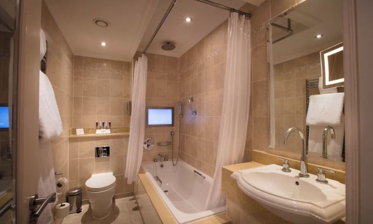 Guest bathroom with tub at The Royal Horseguards Hotel.