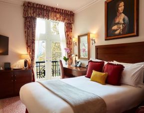 Day room with work desk and TV at The Royal Horseguards Hotel.