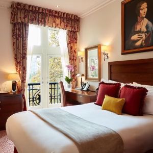 Day room with work desk and TV at The Royal Horseguards Hotel.