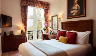 Day room with work desk and TV at The Royal Horseguards Hotel.