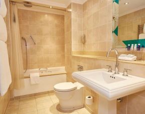 Guest bathroom with tub and free toiletries at The Royal Horseguards Hotel.