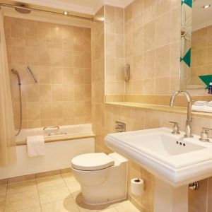 Guest bathroom with tub and free toiletries at The Royal Horseguards Hotel.