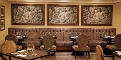 Dining area with comfortable seating at The Royal Horseguards Hotel.