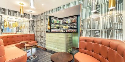 Hotel bar with lounge area at Mercure Hotel London Paddington.