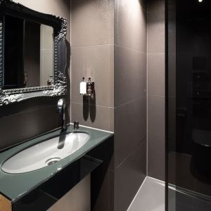 Guest bathroom with shower and free toiletries at Bloc Hotel.