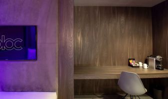 Work desk and coffee maker inside a day use room at Bloc Hotel.