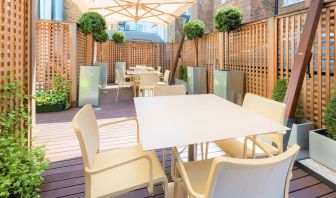 Outdoor patio with sitting area perfect for co-working at Hotel Indigo London Paddington,