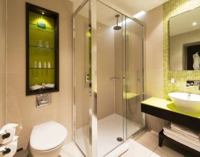 Guest bathroom with shower at Hotel Indigo London Paddington,