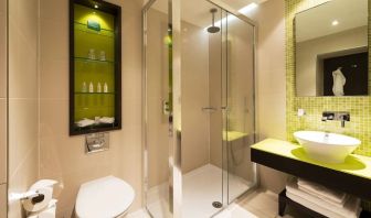 Guest bathroom with shower at Hotel Indigo London Paddington,