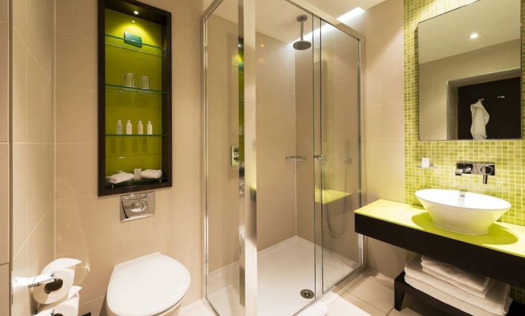 Guest bathroom with shower at Hotel Indigo London Paddington,