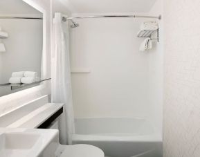 Guest bathroom with shower and tub at Holiday Inn Express New York City - Chelsea.