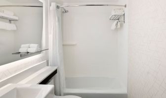 Guest bathroom with shower and tub at Holiday Inn Express New York City - Chelsea.