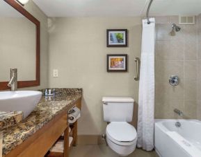 Guest bathroom with shower and tub at Comfort Inn & Suites Glen Mills – Concordville.