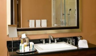 Guest bathroom with shower at The Bostonian Boston, A Millennium Hotel.