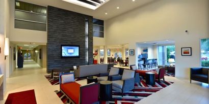 Lobby and coworking lounge at Hawthorn Suites By Wyndham El Paso Airport.