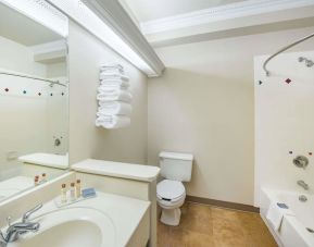 Guest bathroom with shower and tub at Hawthorn Suites By Wyndham El Paso Airport.