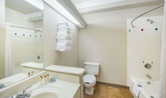 Guest bathroom with shower and tub at Hawthorn Suites By Wyndham El Paso Airport.