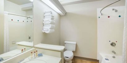 Guest bathroom with shower and tub at Hawthorn Suites By Wyndham El Paso Airport.