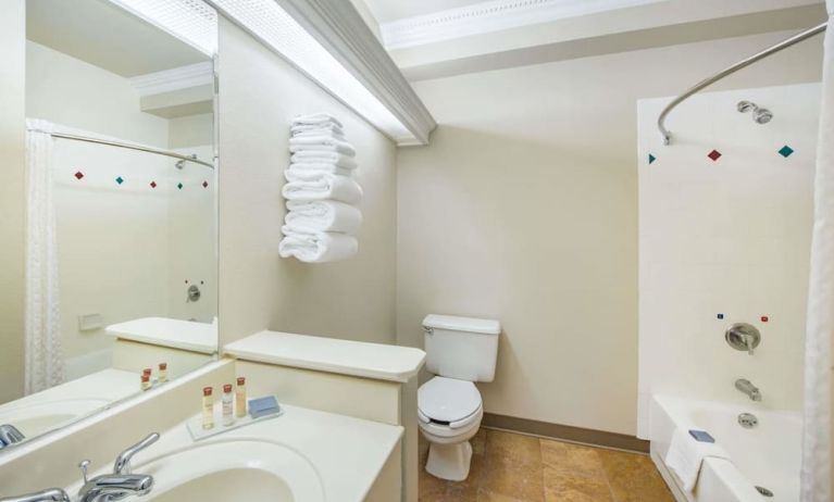 Guest bathroom with shower and tub at Hawthorn Suites By Wyndham El Paso Airport.