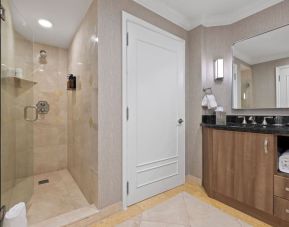 Guest bathroom with shower at The Atlantic Hotel & Spa.