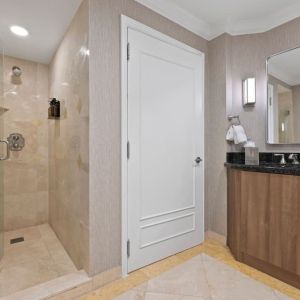 Guest bathroom with shower at The Atlantic Hotel & Spa.