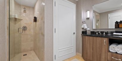 Guest bathroom with shower at The Atlantic Hotel & Spa.