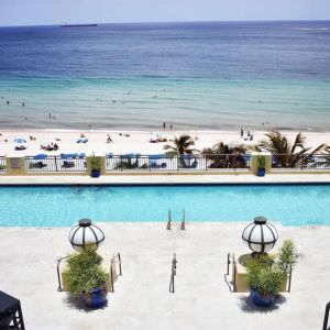 Refreshing outdoor pool with ocean view at The Atlantic Hotel & Spa.