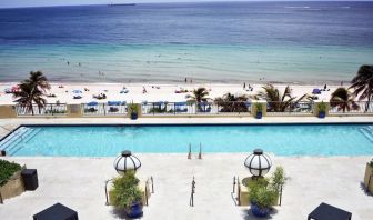 Refreshing outdoor pool with ocean view at The Atlantic Hotel & Spa.